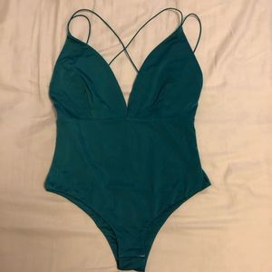 Turquoise body suit